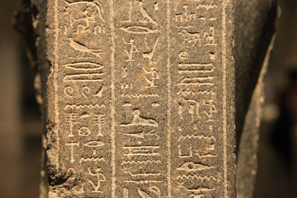 Ancient hieroglyphic markings on concrete slab