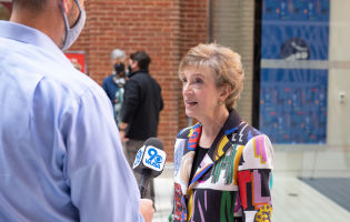 Founder Ann Friendman talking to a reporter