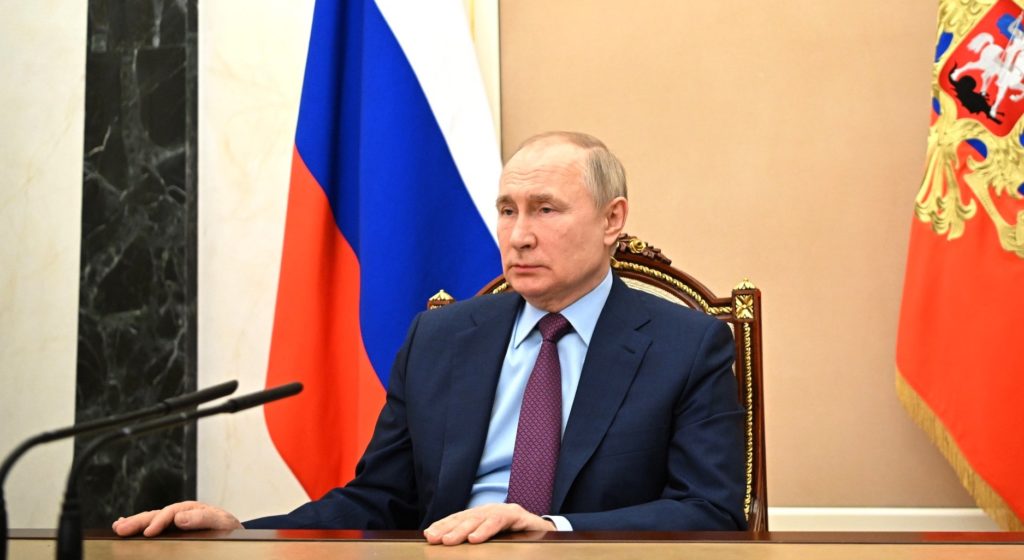 Putin sitting at press conference