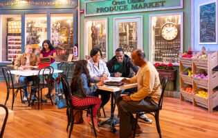 Four people at a table undertaking a scavenger hunt