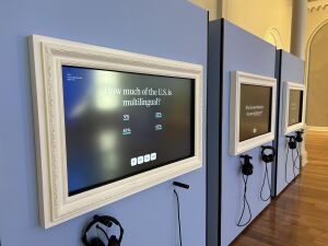The Multilingualism Beacon in Planet Word's Spoken World gallery. It is a touchscreen display showing a multiple choice question with four answers: How much of the U.S. is multilingual? 5%, 20%, 45%, 60%