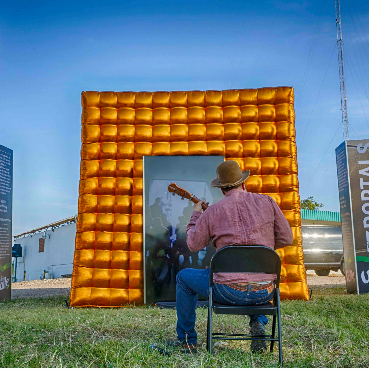 A musician at the inflatable Portal in Veracruz, Mexico, performing live for an audience at the portal in Mexico City.