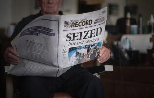 A newspaper headline in the Marion County Record: SEIZED ... but not silenced